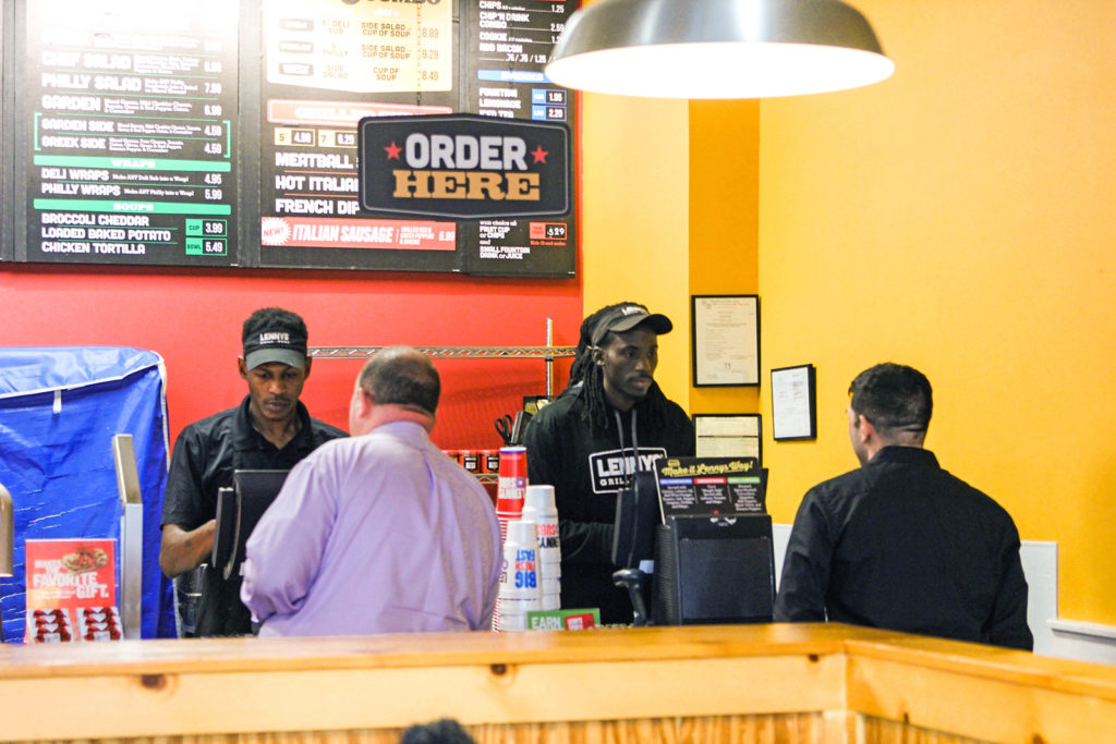 lennys subs sandwich franchise shot of employees taking orders